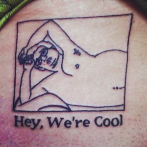 A logo for Hey, We're Cool tattooed on Pat Reber.